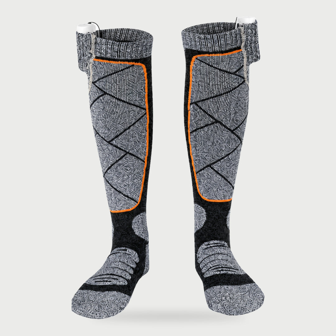 Knee-high electric heated ski socks in Gray with orange trim and cuff power bank pockets