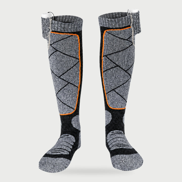 Knee-high electric heated ski socks in Gray with orange trim and cuff power bank pockets