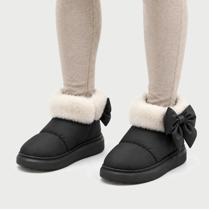 Women's winter booties in Black with faux fur cuff and heel bow