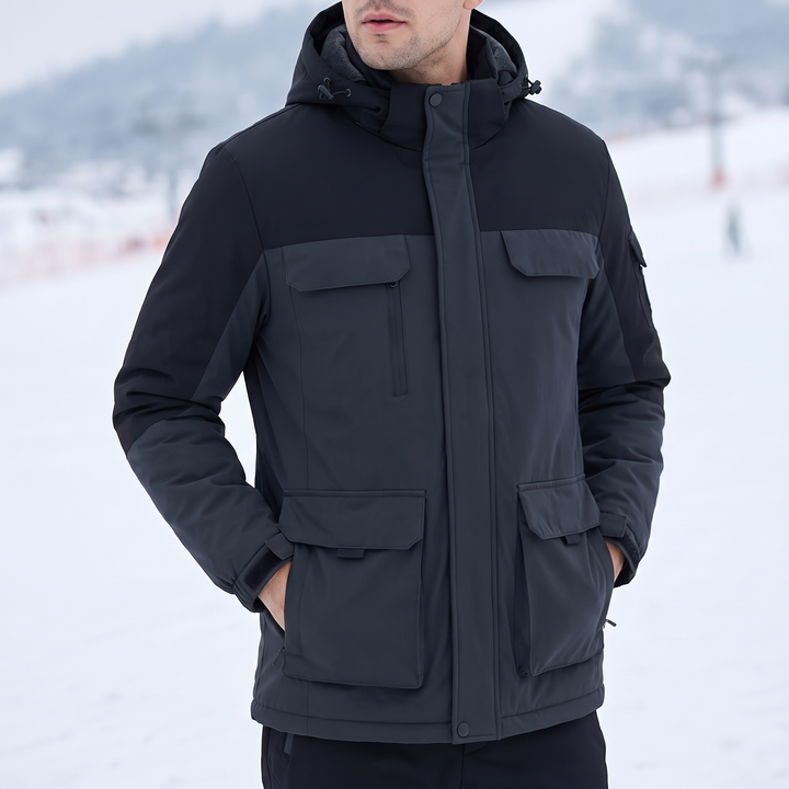 Man wearing the hooded ski jacket on the slopes