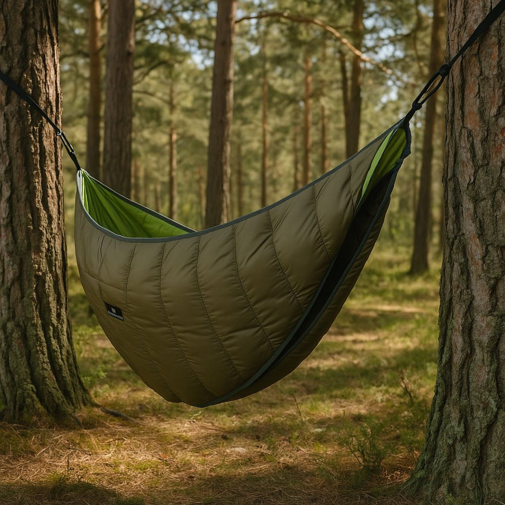 Hammock underquilt hanging under a hammock between pine trees