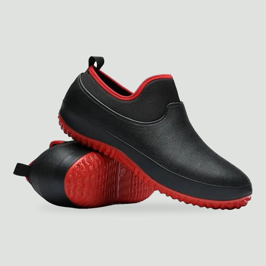 Non slip work shoes in Black Red, side view with the red lugged sole