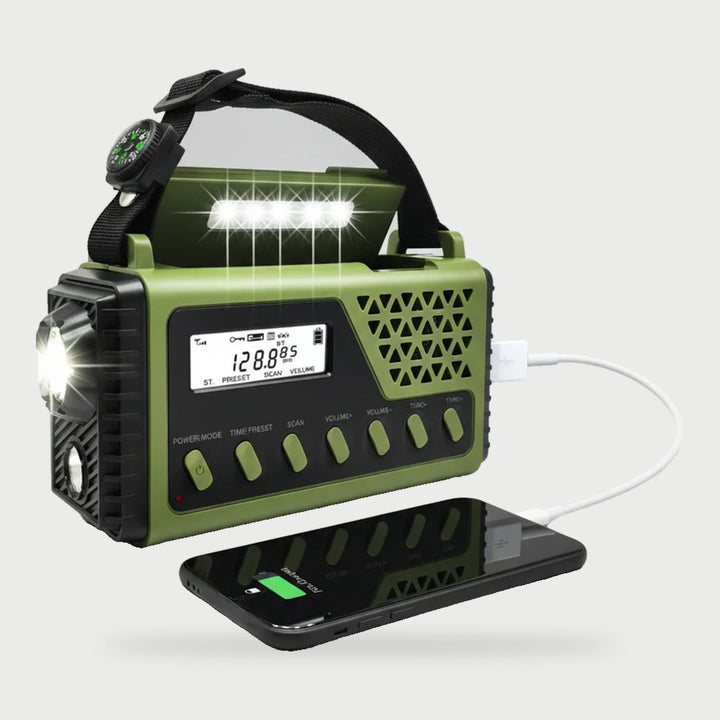 Shortwave hand crank emergency radio in Army Green charging a phone