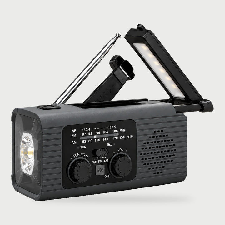 Gray weather radio with NOAA weather band, hand crank, fold-up reading lamp and flashlight