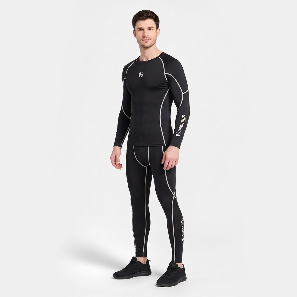 Man wearing the Black/White base layer set, three-quarter view showing the piping on the top and leggings