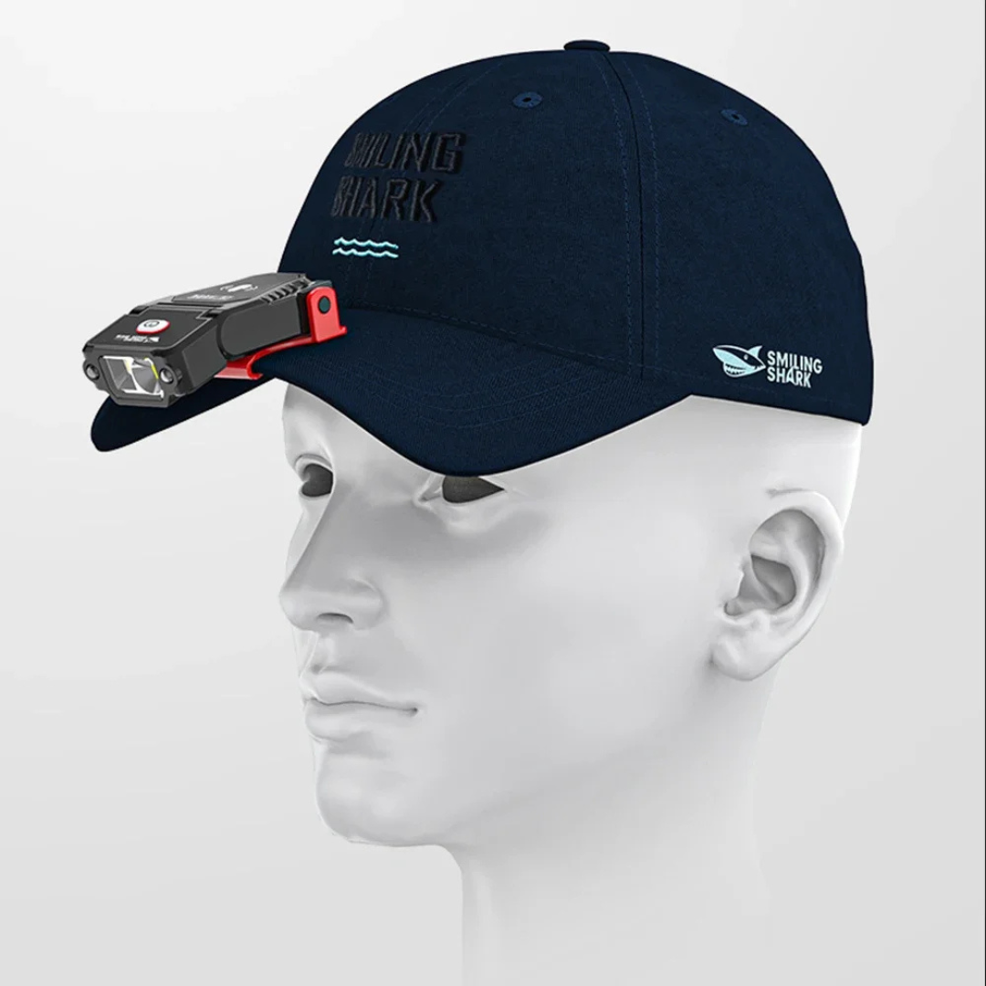 Clip on hat light worn on the brim of a baseball cap