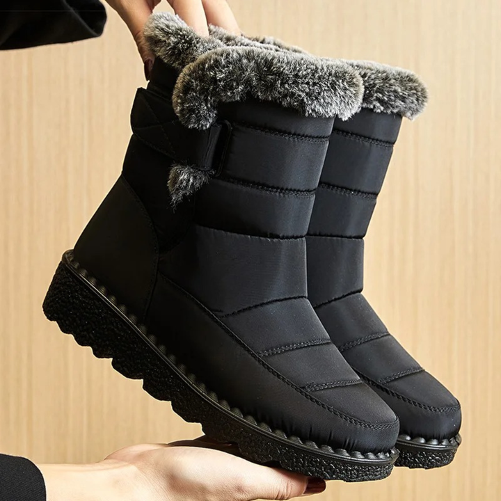 Women's fur lined boots in Black with faux fur cuff