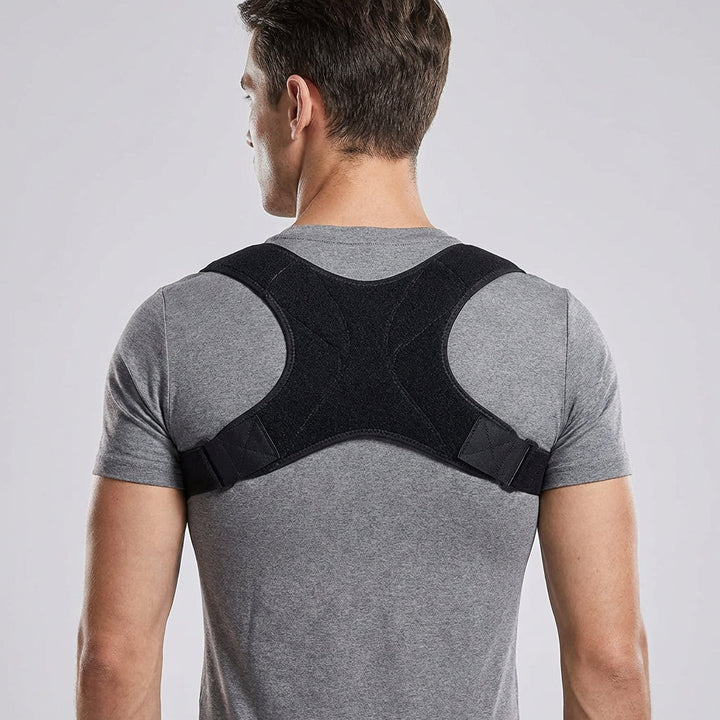 Man wearing the back and shoulder support brace over a grey T-shirt, back view