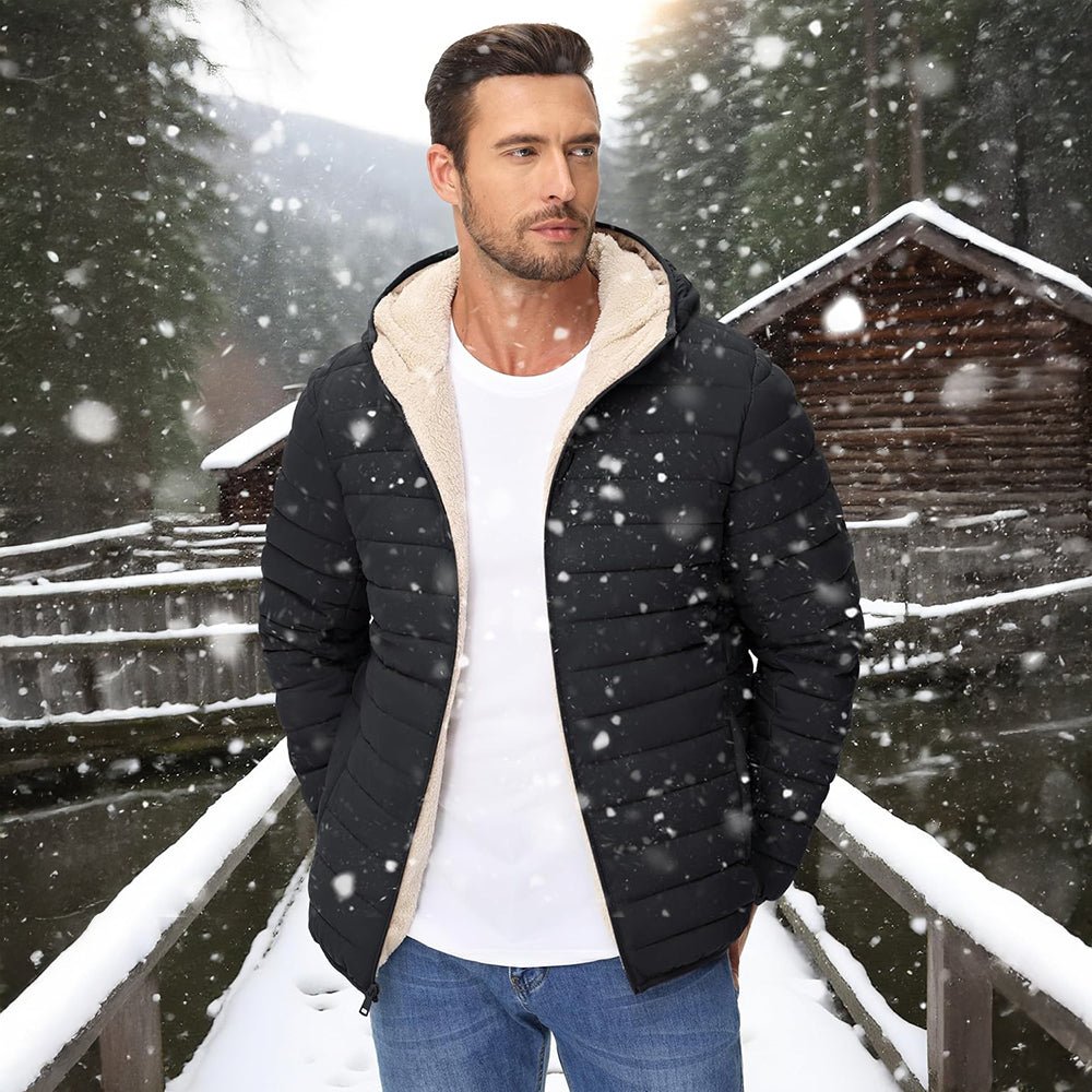 Man wearing the men's quilted jacket in Black in the snow