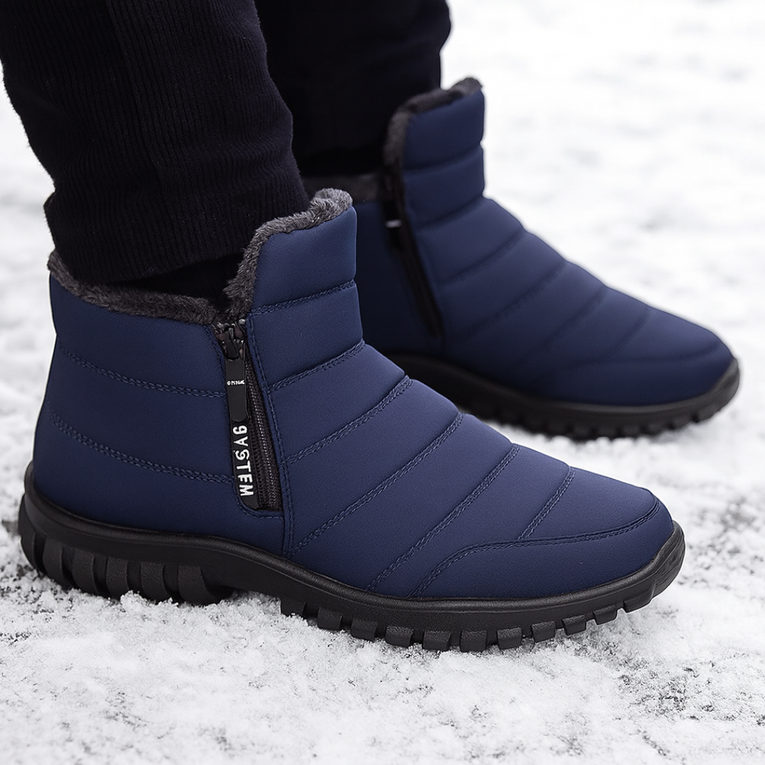 Man wearing navy quilted winter boots in the snow