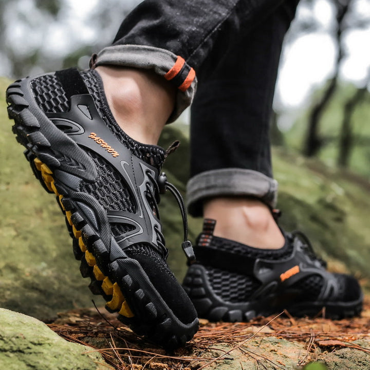Hiker wearing the black water hiking shoes on a rocky trail
