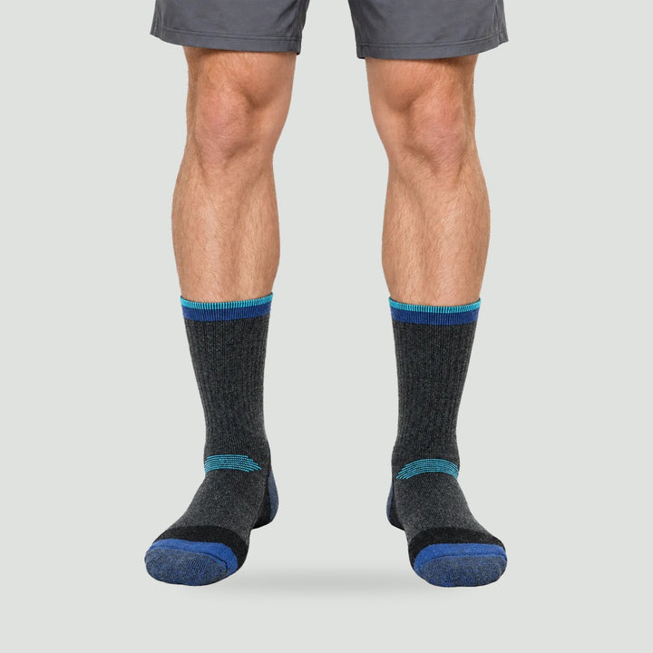 Thick wool ski socks in Navy, worn, front view