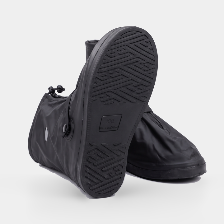 Underside of the rain shoe cover showing its own thick sole with a maze-pattern tread