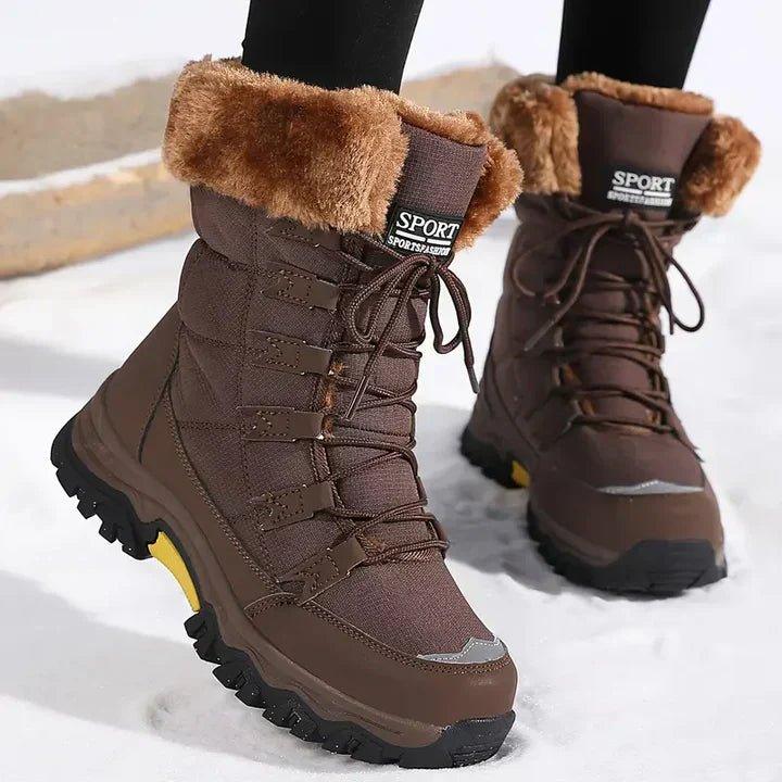 Women's snow boots in Brown with faux fur cuff, worn in the snow