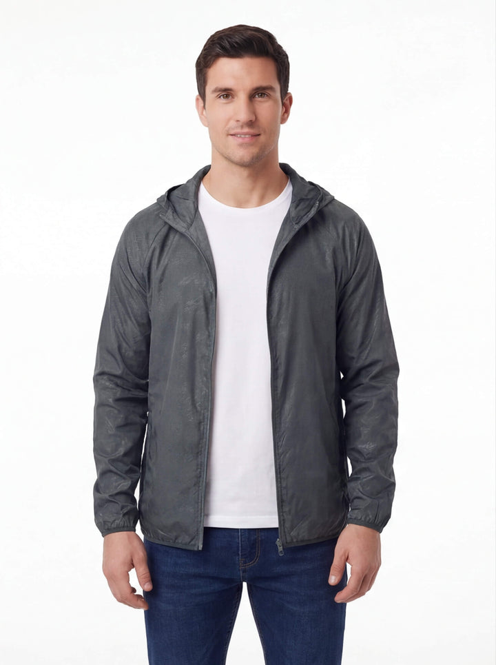 Man wearing the lightweight rain jacket in Gray, open over a T-shirt