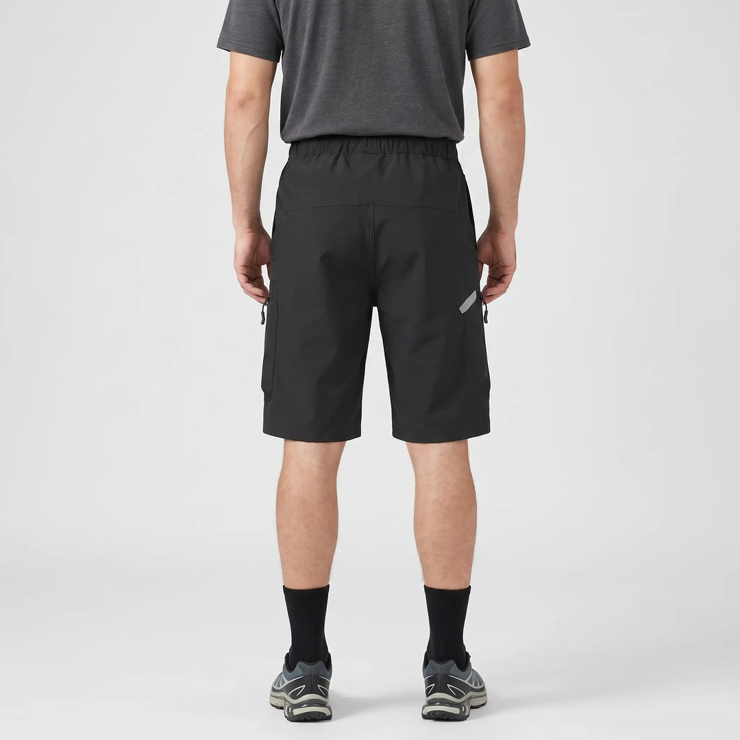 Black MTB shorts worn, back view with elastic waistband