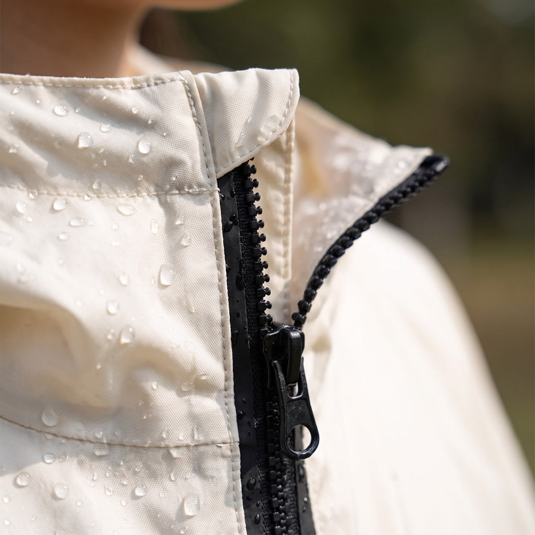 Rain poncho detail with front zip and hood collar
