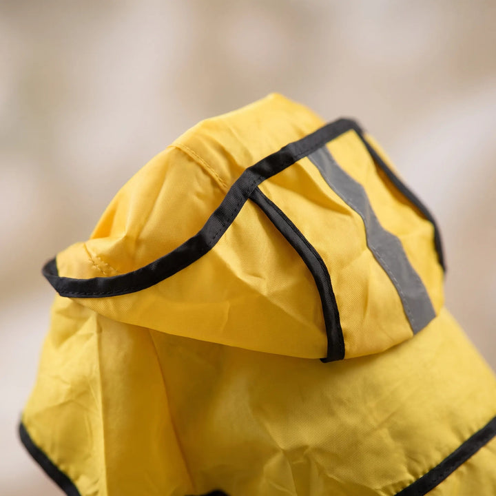 Close up of the dog raincoat hood with black piping and reflective strip