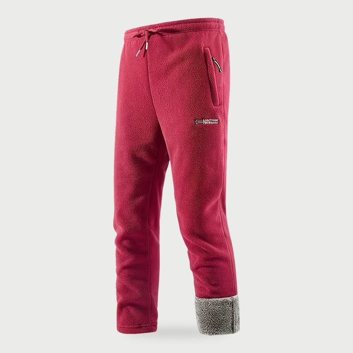 Men's red fleece pants with the plush lining showing at the hem
