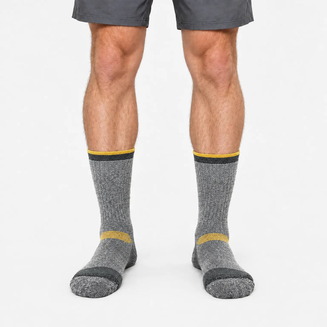 Thick wool ski socks in Gray and Orange, worn, front view