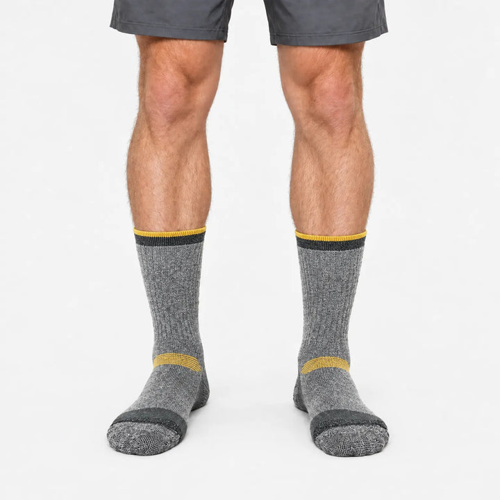 Thick wool ski socks in Gray and Orange, worn, front view