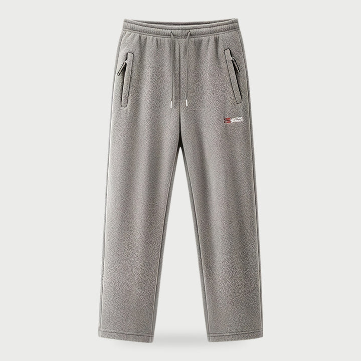 Men's gray fleece pants with drawstring waist and zip side pockets