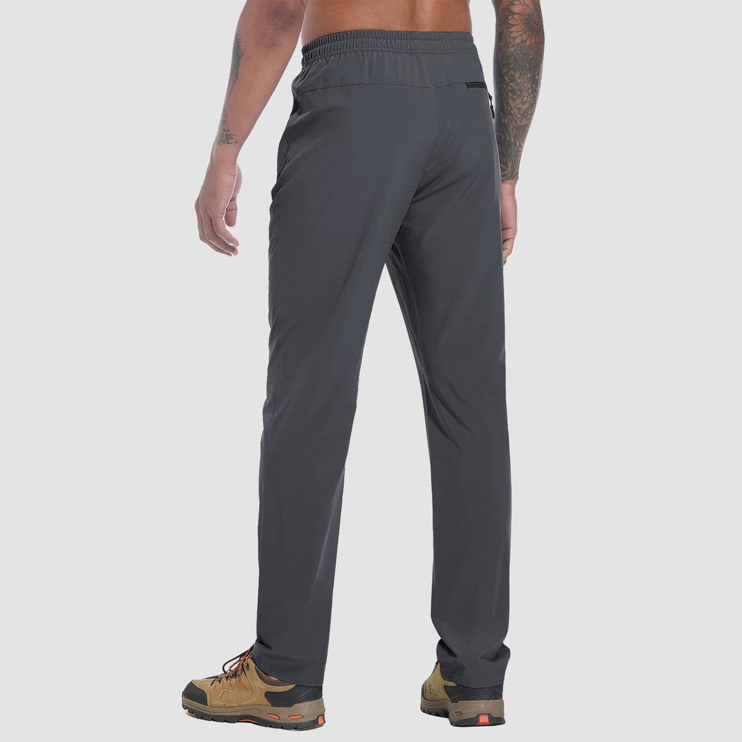 Men's lightweight hiking pants in Dark Gray, back view with zip back pocket