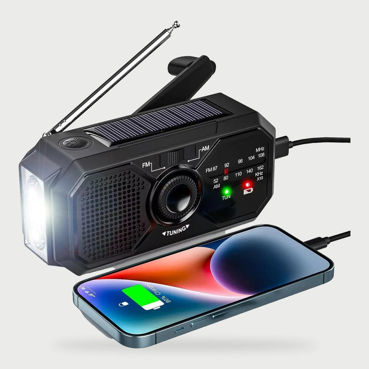 Pocket radio charging a phone from its USB port with the flashlight on