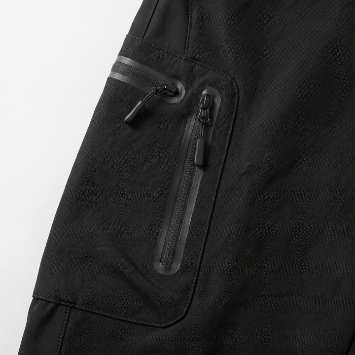 Close-up of the two coated zips on the cargo pocket