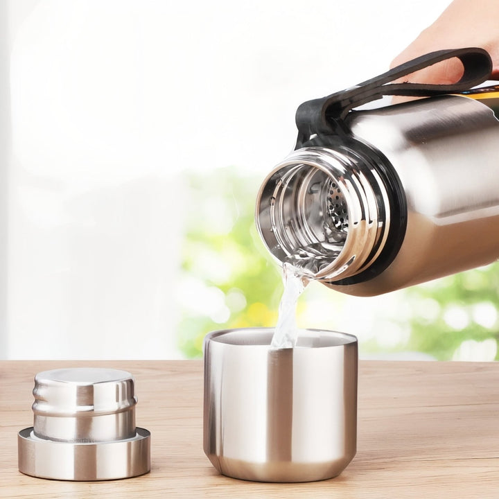 Pouring a hot drink from the thermos into the cup lid