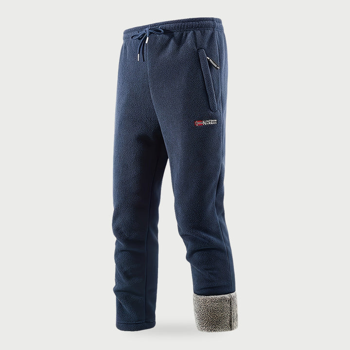 Men's blue fleece pants with the plush lining showing at the hem