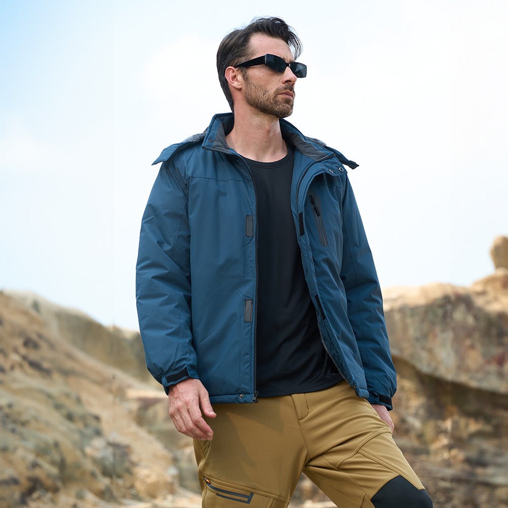 Man wearing the men's snow jacket in Sapphire Blue outdoors