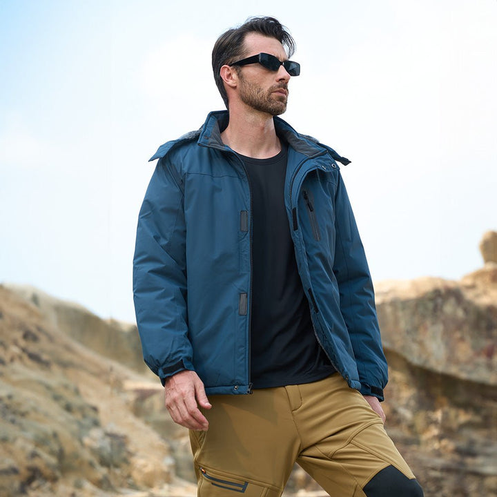 Man wearing the men's snow jacket in Sapphire Blue outdoors