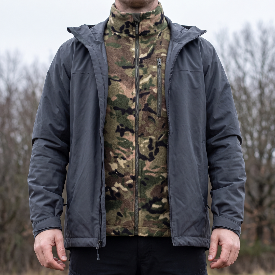 Camo fleece jacket worn as a mid layer under an open waterproof shell