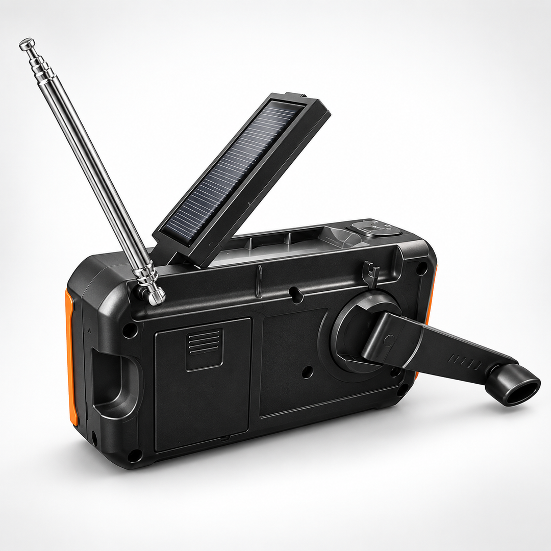 Back of the emergency radio with the fold-out hand crank and battery bay