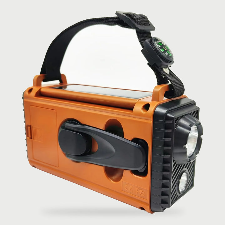 Back of the shortwave radio with the fold-out hand crank and solar panel