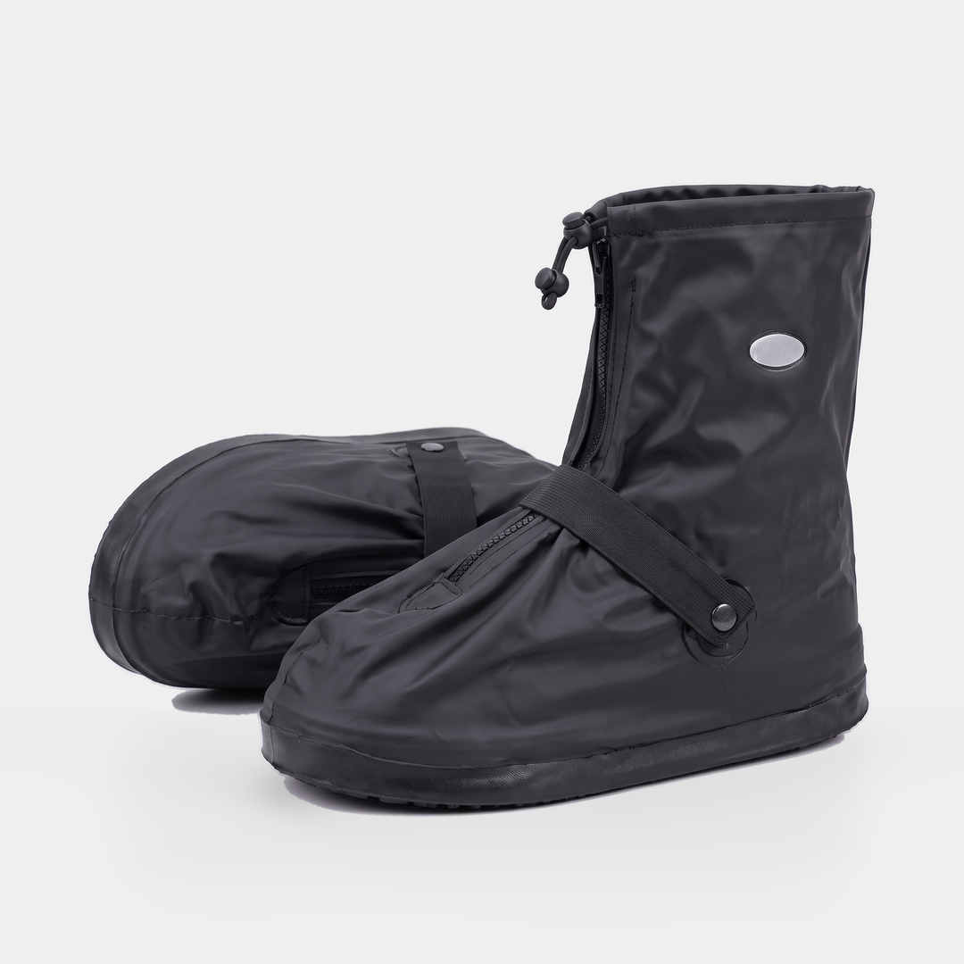 Two rain shoe covers, one lying on its side and one standing, zipped and strapped