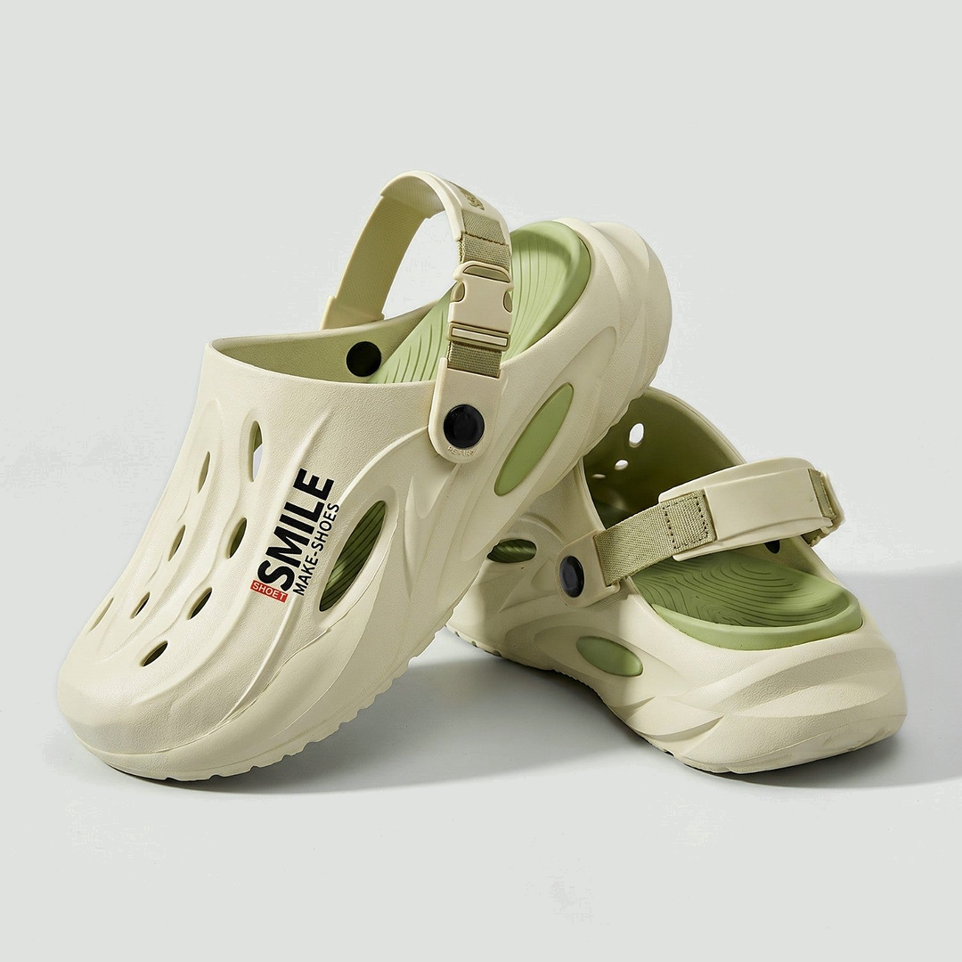 Men's EVA clogs in Mint Green, pair on a light grey studio background