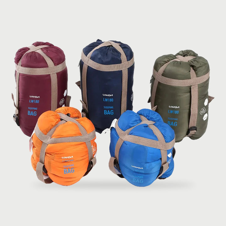 Envelope sleeping bags packed in their stuff sacks in several colors