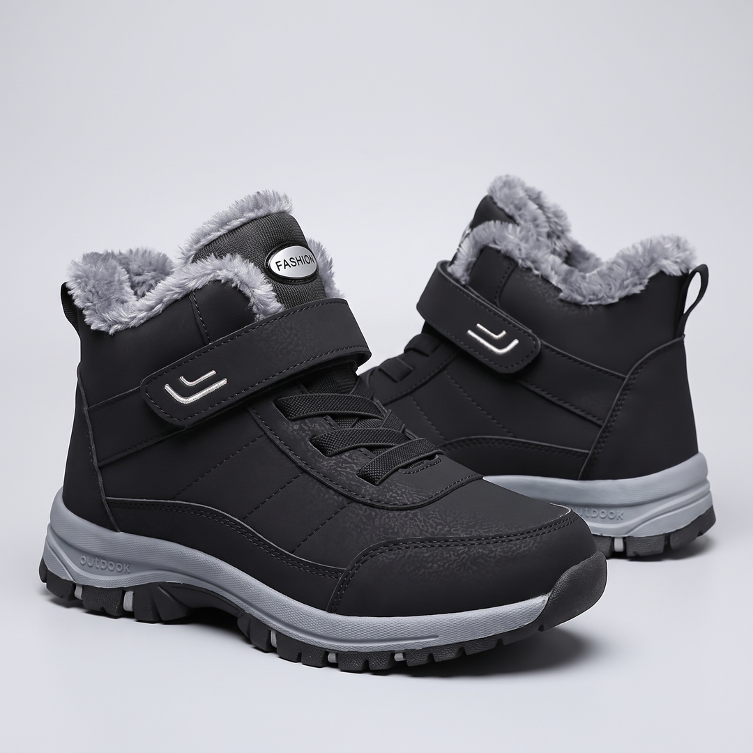Plush lined winter boots for men and women in black, pair on light gray background