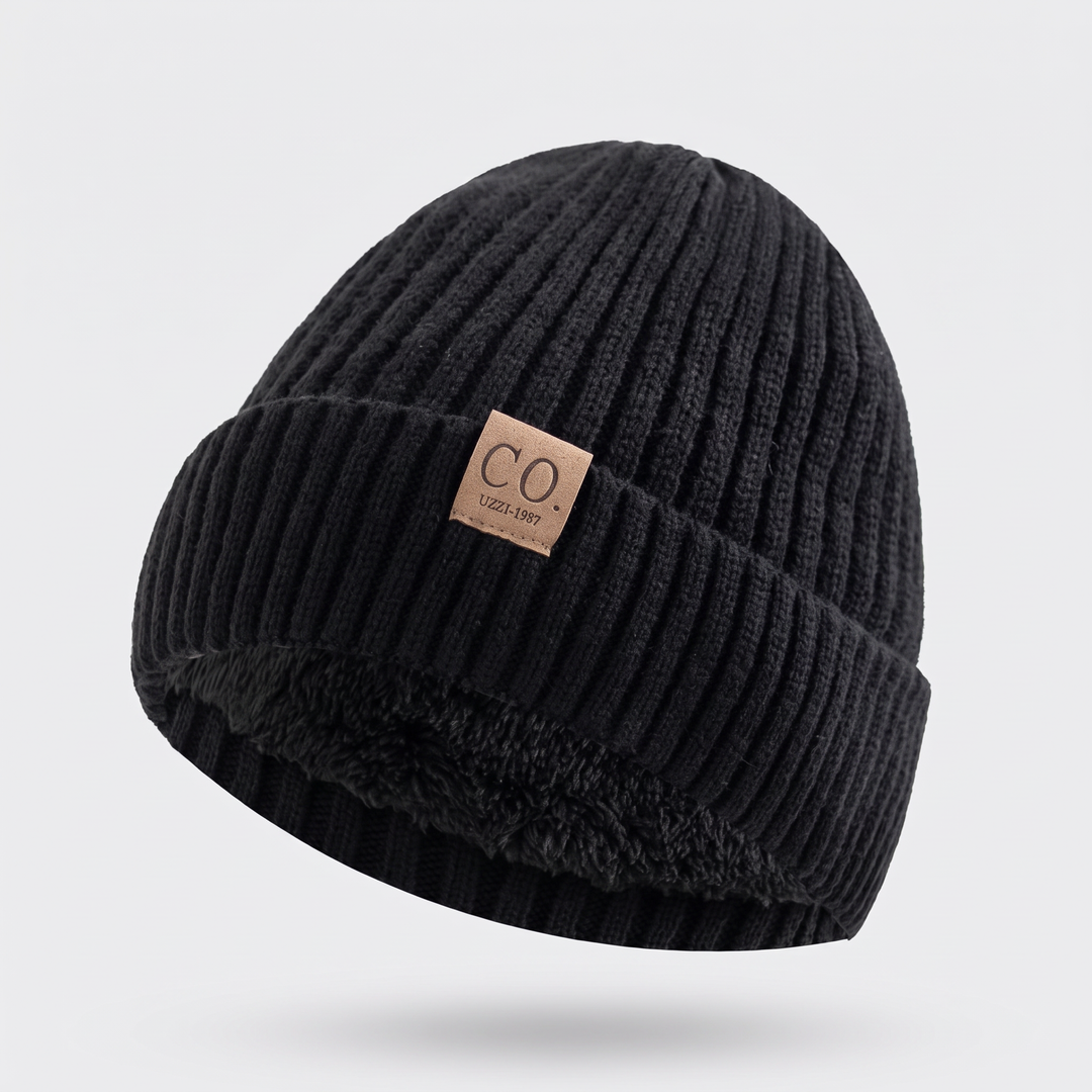 Fleece lined beanie hat in Black with fold-up cuff and leather patch