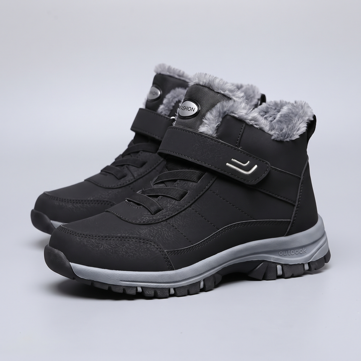 Plush lined winter boots for men and women in black, pair on light gray background