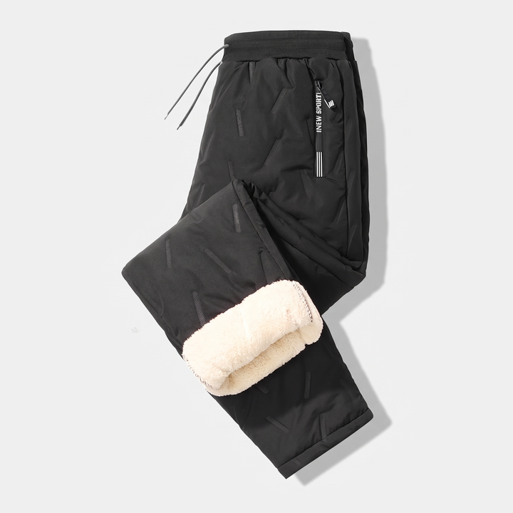 Men's sherpa fleece lined joggers in Black, laid flat with one leg folded to show the lining
