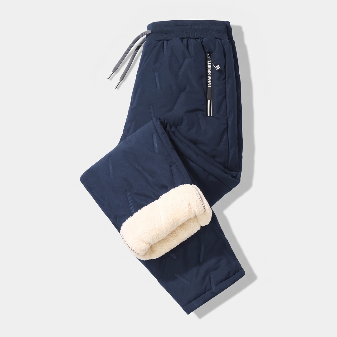 Men's sherpa fleece lined joggers in Navy, laid flat with one leg folded to show the lining