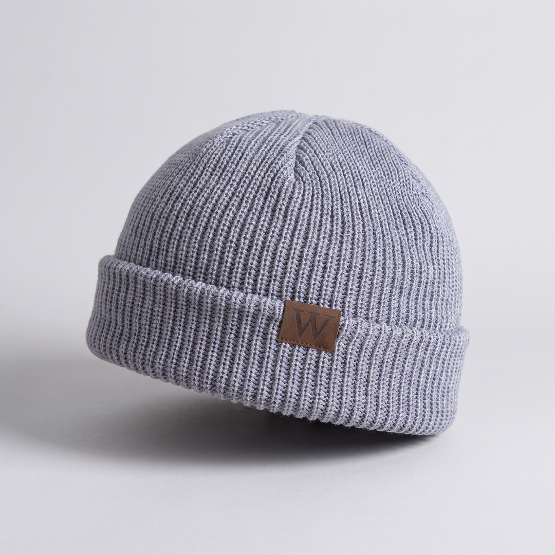 Fisherman Beanie detail - ribbed knit texture and leather patch