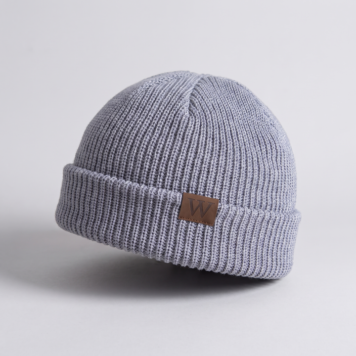 Fisherman Beanie detail - ribbed knit texture and leather patch