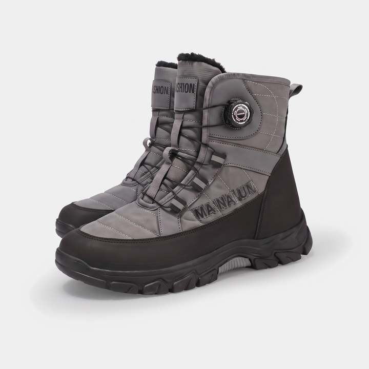 Pair of men's high top snow boots in gray showing both dials and the side wordmark