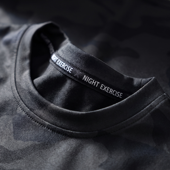 Printed brand label detail on the inner collar of the camo athletic t-shirt