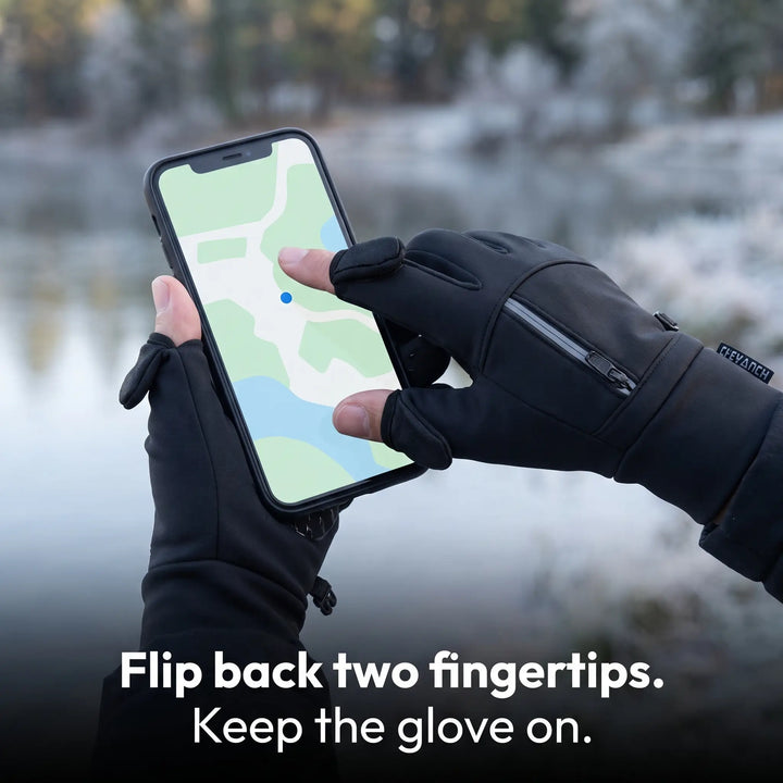 Bare index fingertip on a phone screen with the glove's flip-back tip folded over the knuckle