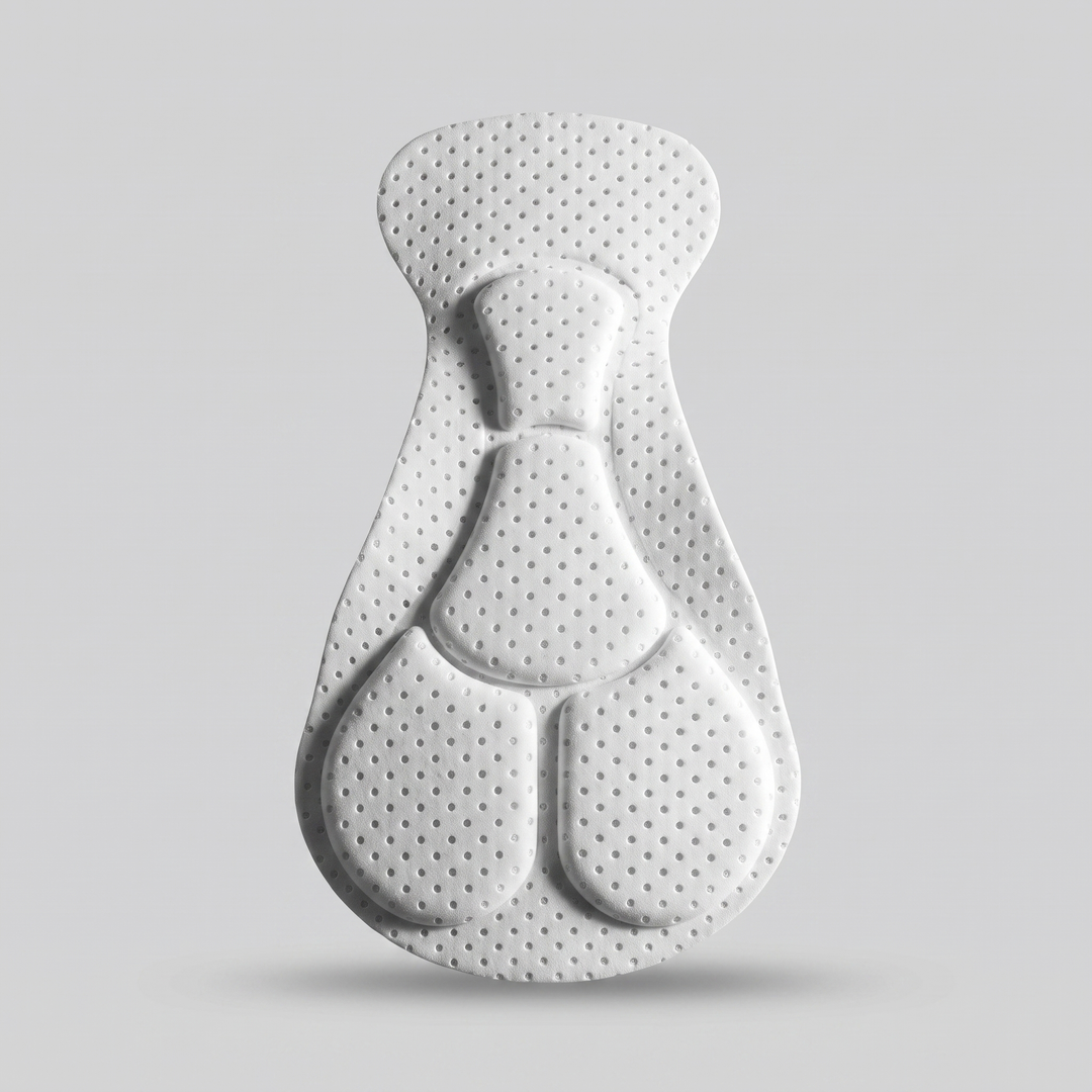 The molded gel chamois pad showing its contoured shape and perforated surface